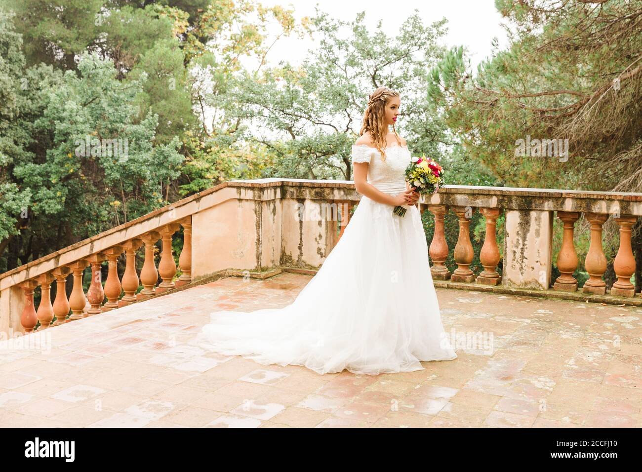 Bride, wedding, garden, young woman, wedding dress, stairs, landscape format Stock Photo