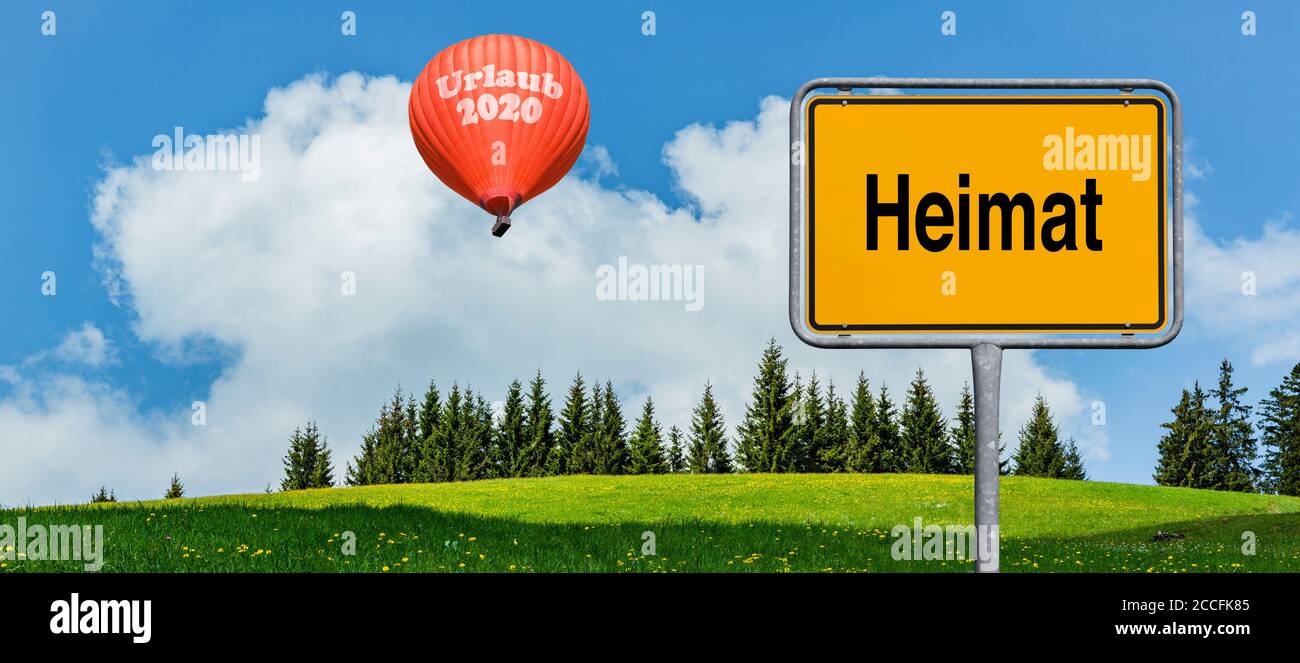 Hot air balloon, symbolic image vacation 2020 with sign home Stock Photo