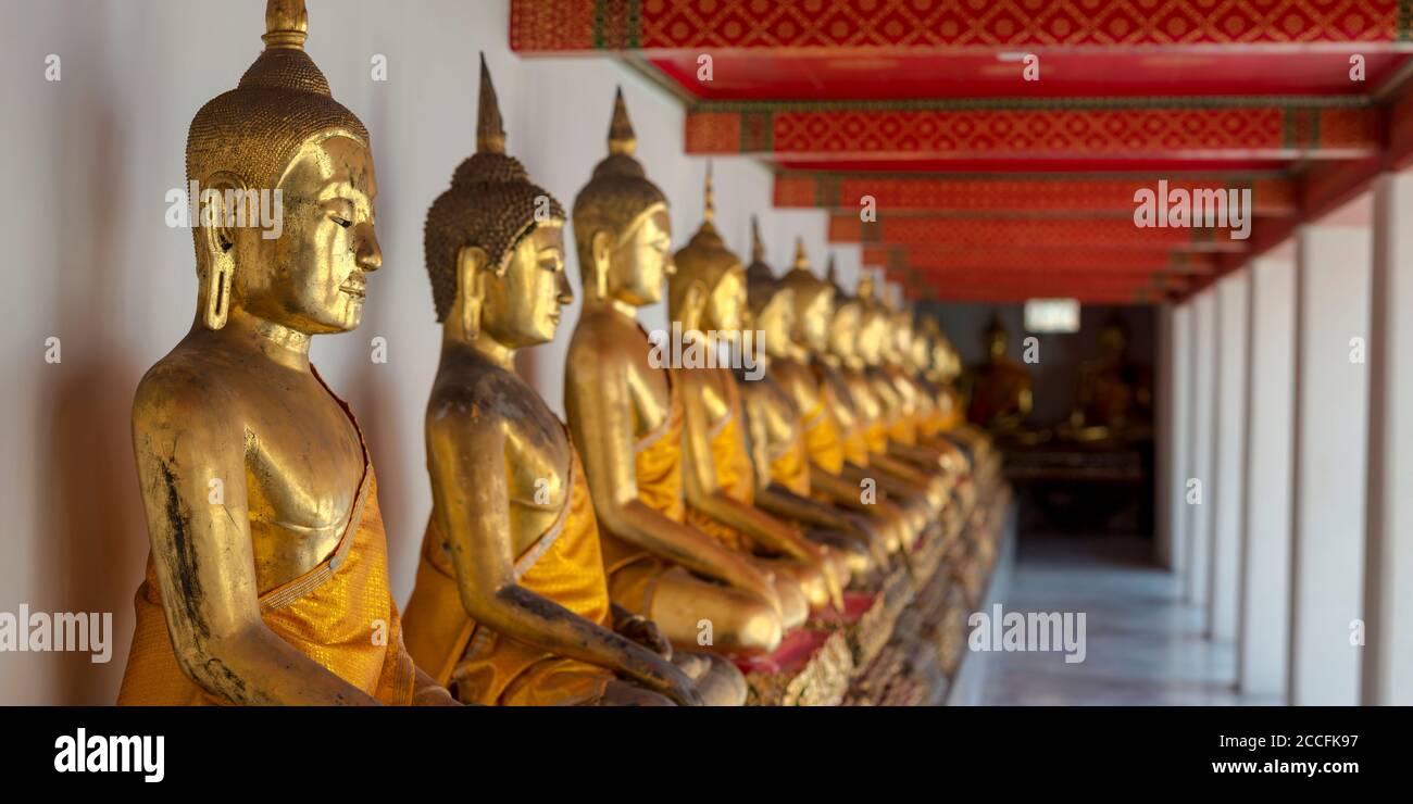 Gilded Buddha statues (Bhumispara-mudra: Buddha Gautama at the moment of enlightenment), Wat Pho, Bangkok, Thailand, Asia Stock Photo