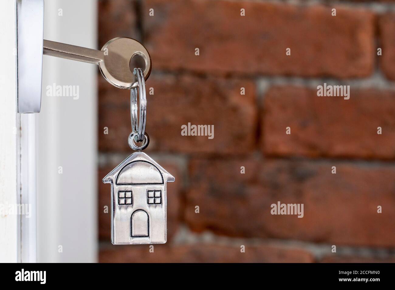 Open door with keys of house Stock Photo Alamy