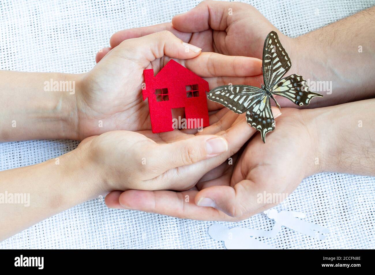 Donation concept, Hands, house and butterfly Stock Photo