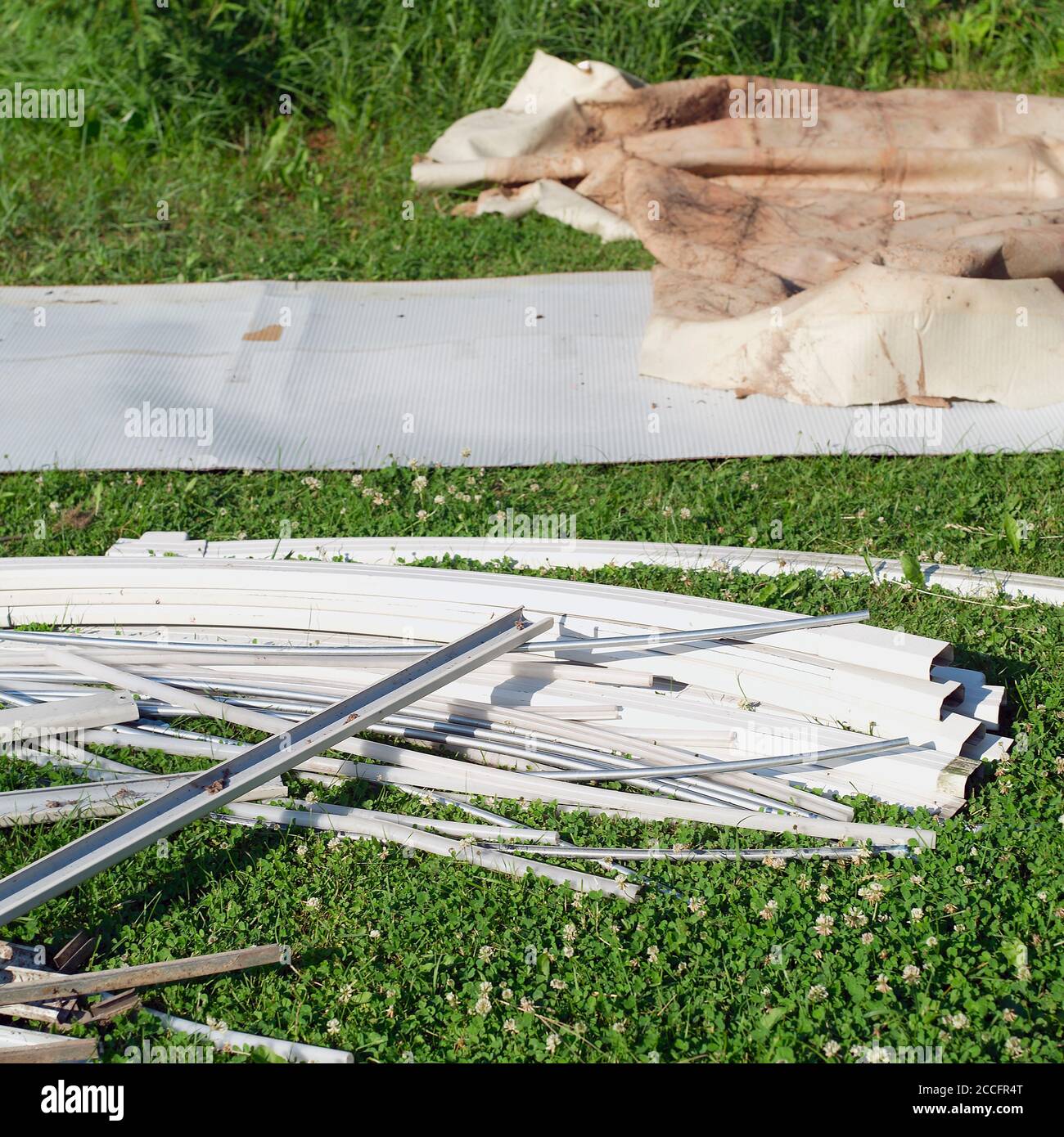 Metal rails and parts of disassembled above ground pool Stock Photo - Alamy