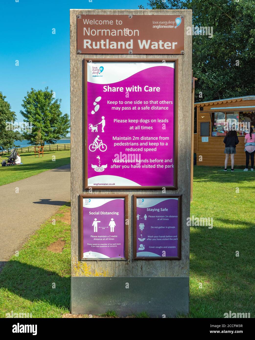 Social distancing notice board (during coronavirus / covid-19 pandemic) in summer sunshine. Rutland Water, Normanton, England, UK. Stock Photo