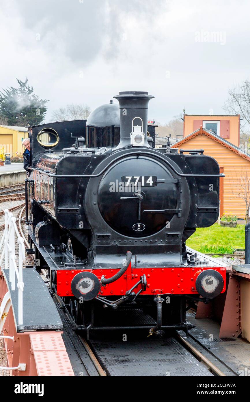 Ex-GWR 0-6-0 pannier tank steam loco 7714 approaching the turntable at Minehead station, West Somerset Railway Spring Gala event, England, UK Stock Photo