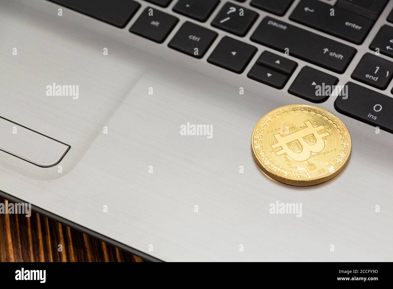 Virtual currency. Bitcoin gold coin. The concept of cryptocurrency. Stock Photo