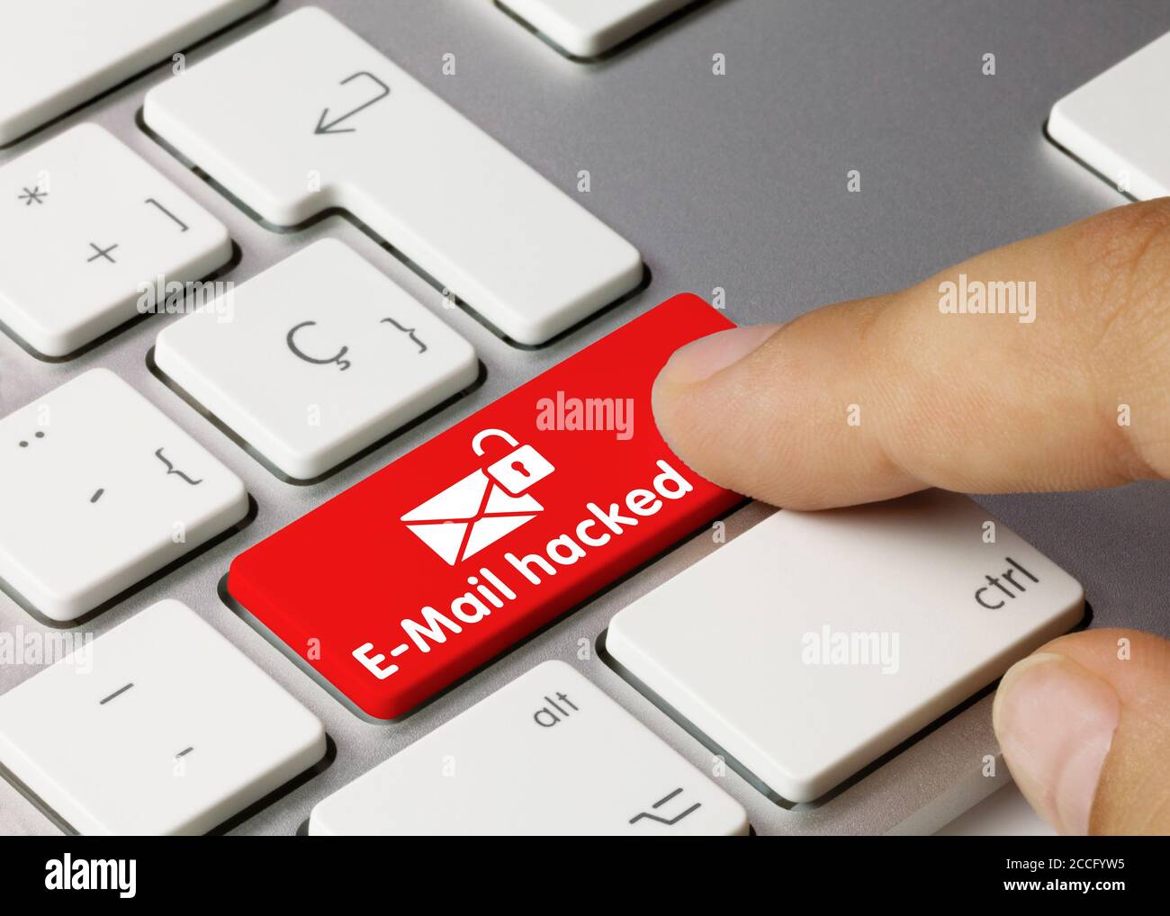 E-Mail hacked Written on Red Key of Metallic Keyboard. Finger pressing ...