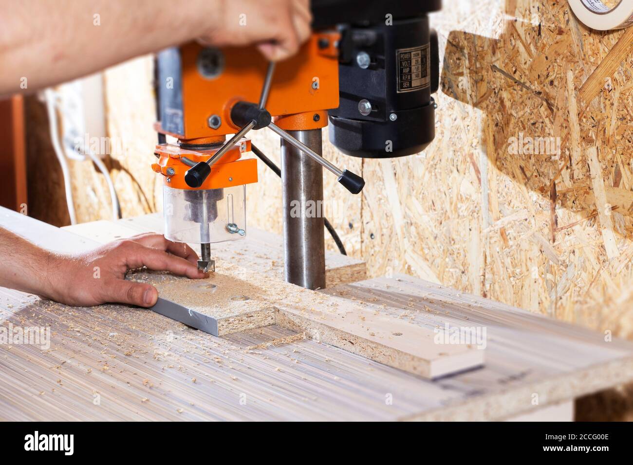 Drill in the drilling machine, making furniture Stock Photo