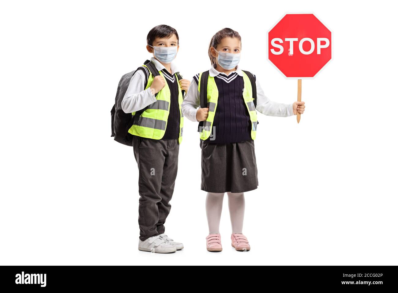 Full length portrait of a schoolboy and a schoolgirl with safety vests