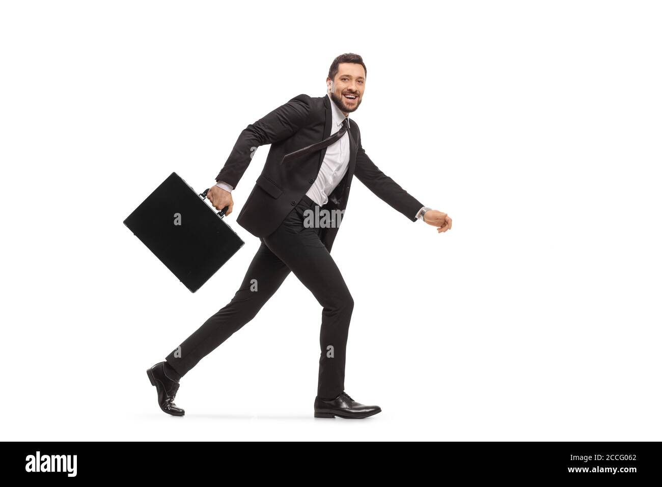 Businessman with a briefcase running and smiling isolated on white ...