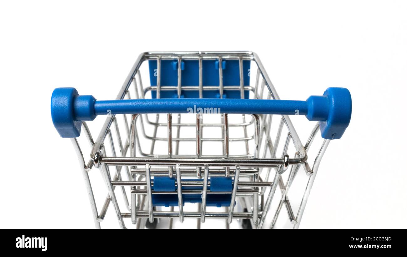 Shopping cart on white background photographed from behind Stock Photo