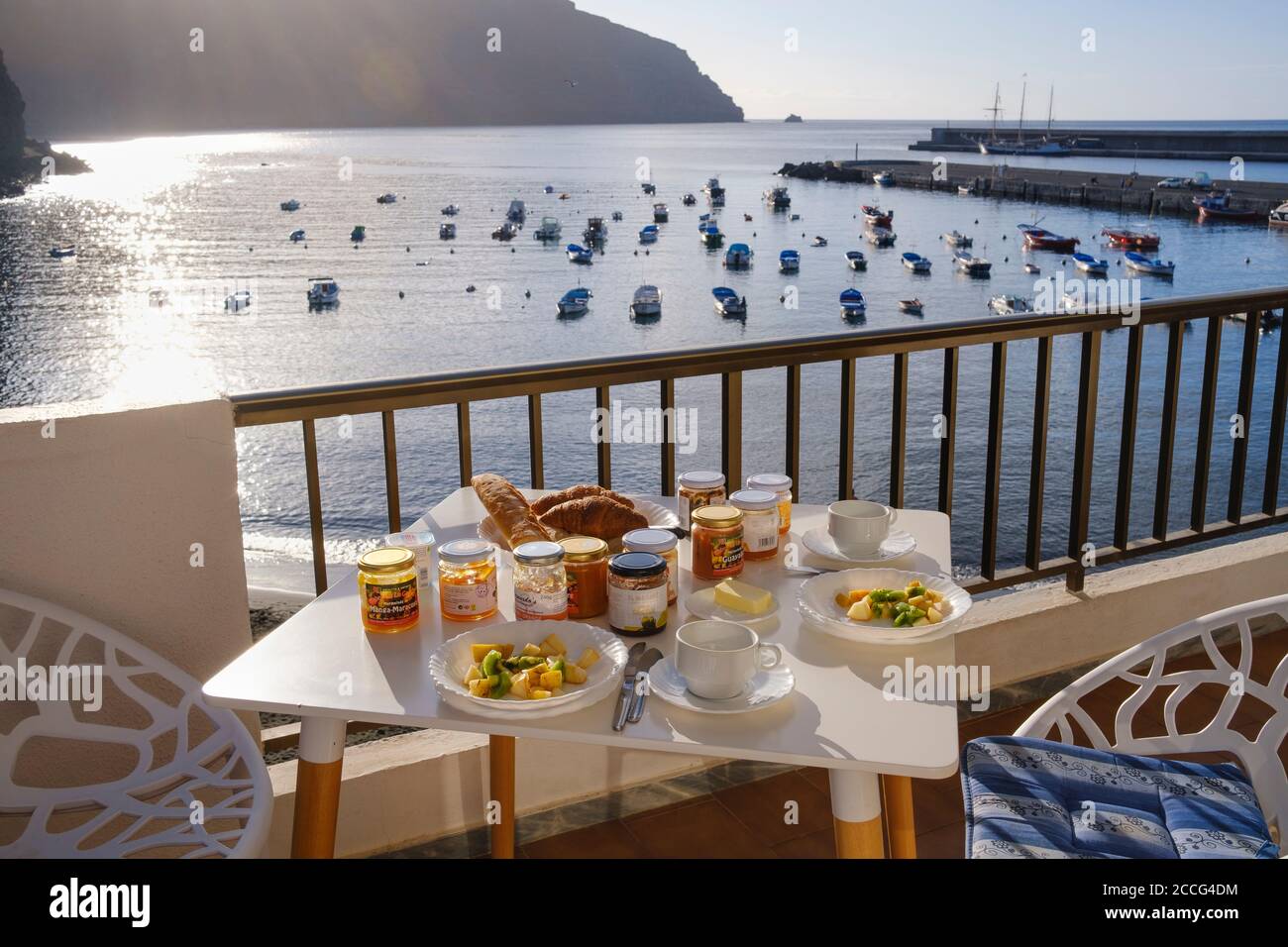laid table with breakfast on balcony over fishing port by the sea, Vueltas,  Valle Gran Rey, La Gomera, Canary Islands, Spain Stock Photo - Alamy