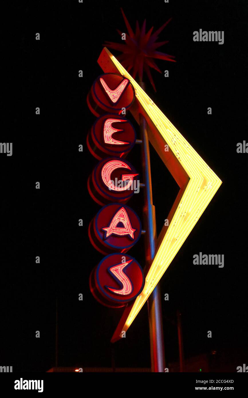 "Oscar's Neon Martini Glass" and Vegas giant neon sign on display above