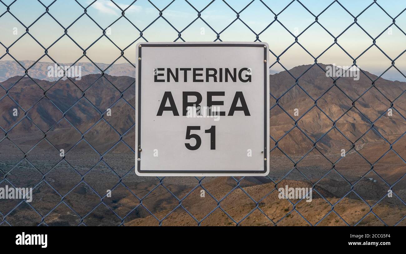 Entering Area 51 Sign On A Fence At The Military Base In The Nevada Desert At Sunset Stock Photo