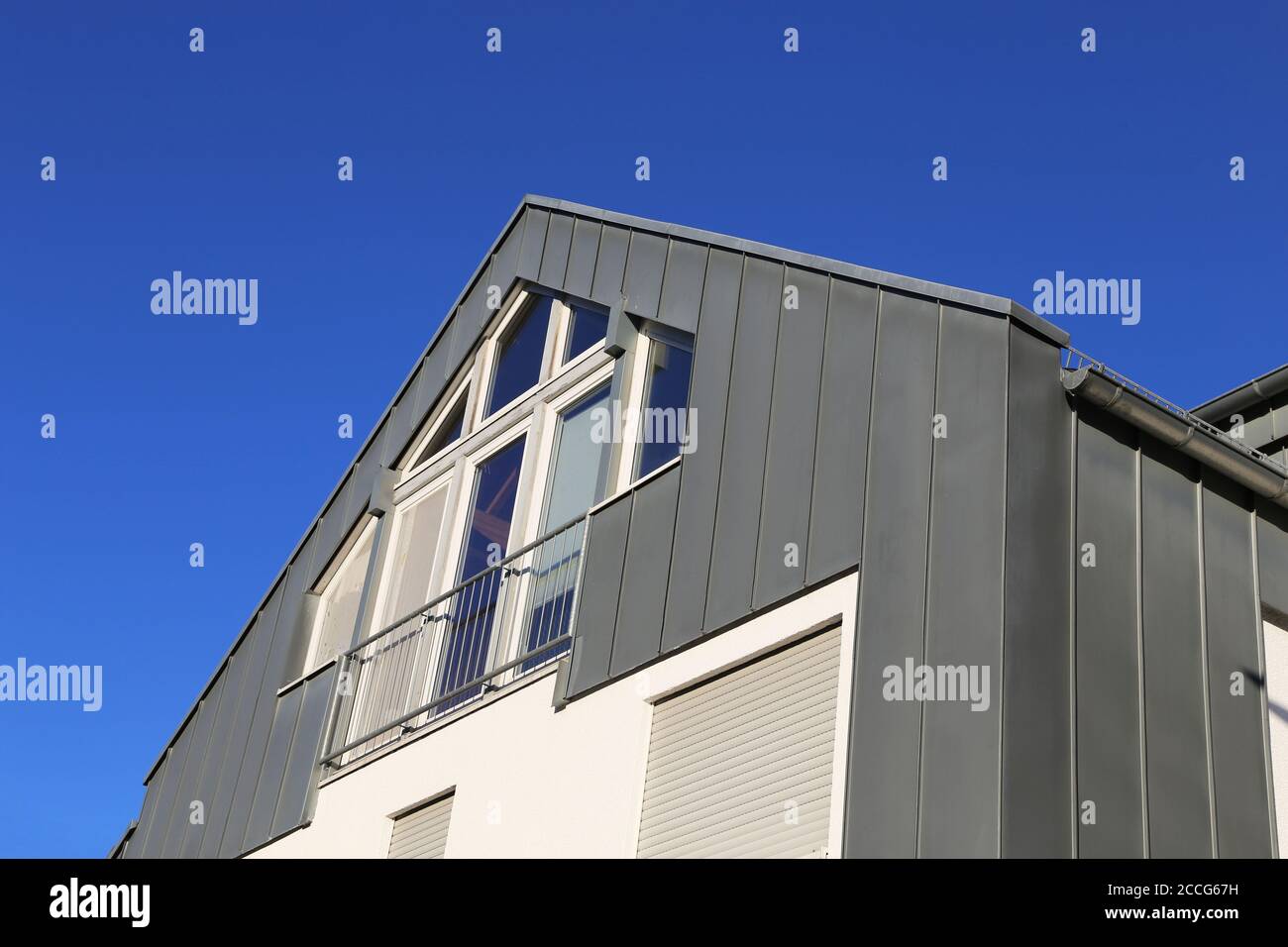 Residential home with modern standing seam facade Stock Photo