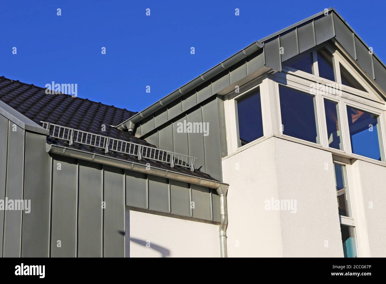 Residential home with modern standing seam facade Stock Photo