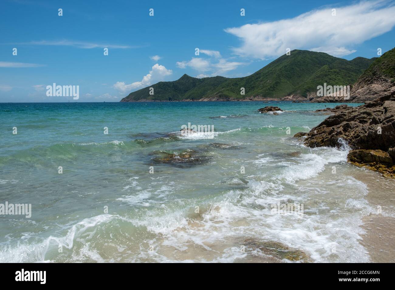 Waves gently crashing on Ham Tin beach in Sai Kung, Hong Kong Stock Photo
