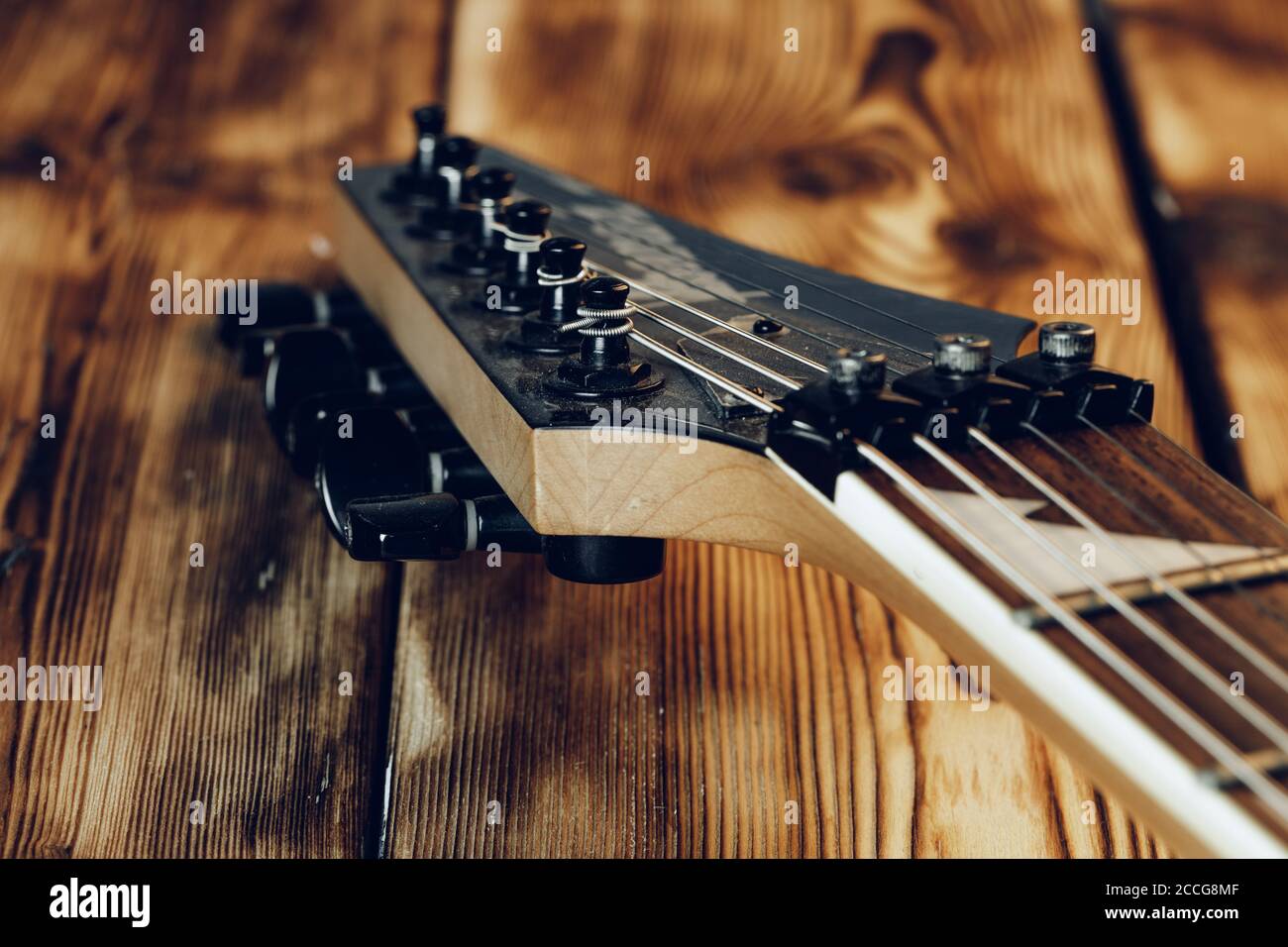 Guitar headstock with tuners on dark background Stock Photo Alamy