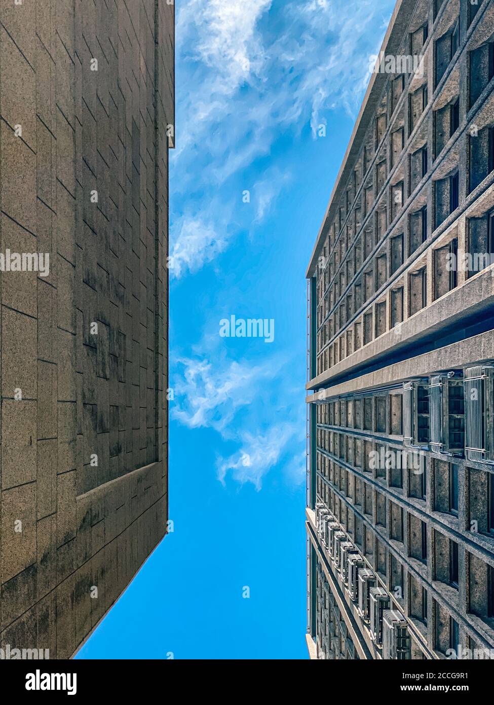 Vertical shot of tall modern buildings under a blue clear sky Stock ...