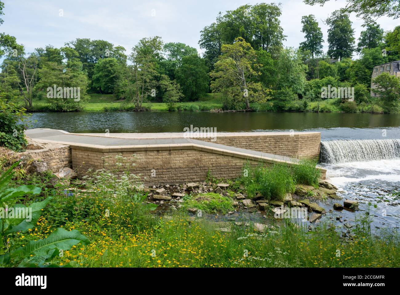 Modern stone fish pass built at a weir on the River Wharfe at Boston Spa, West Yorkshire Stock Photo