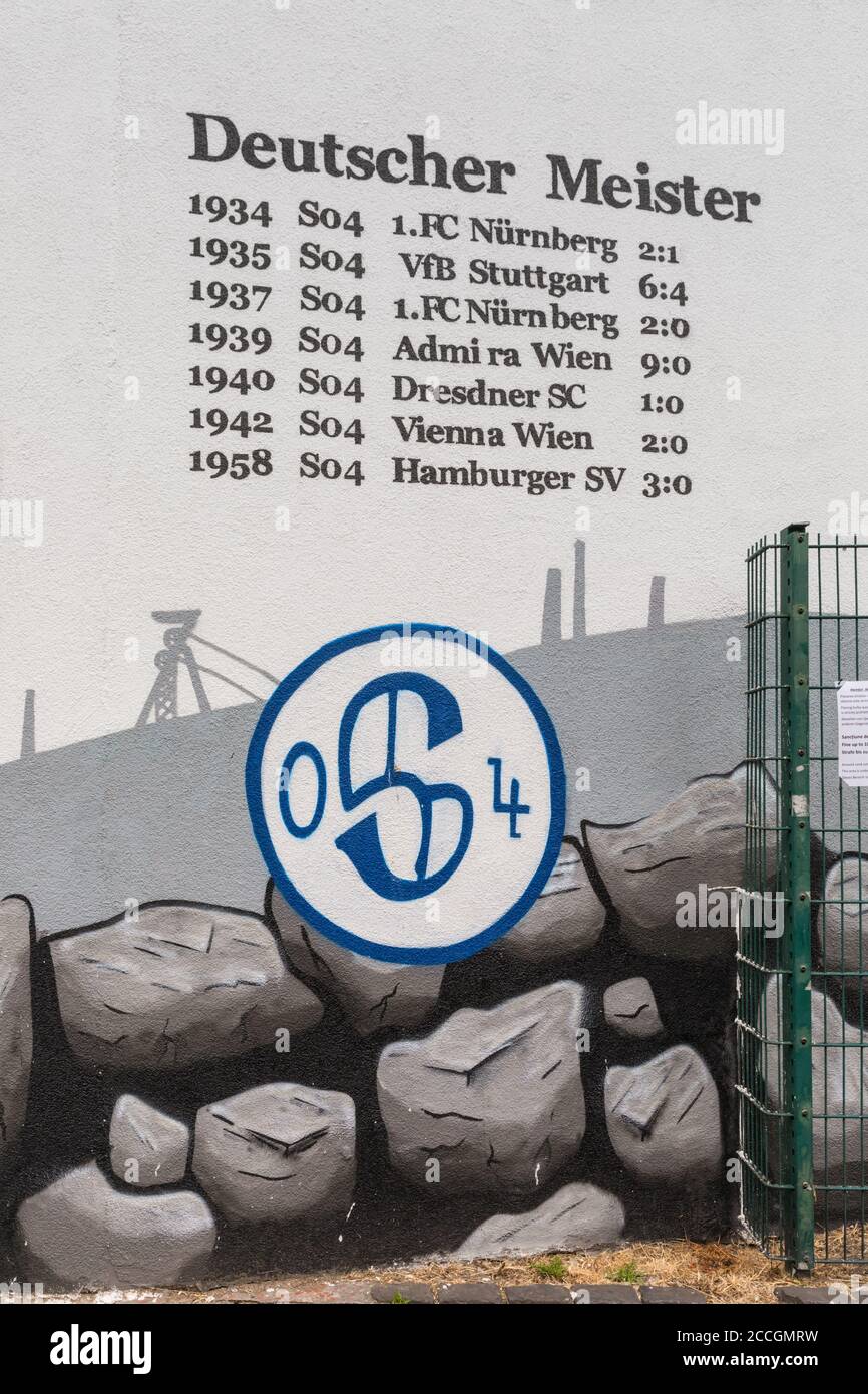 Wall inscriptions and grafitti of FC Schalke 04 football club championship titles at Schalker Meile fan area, North Rhine-Westphalia, Germany Stock Photo