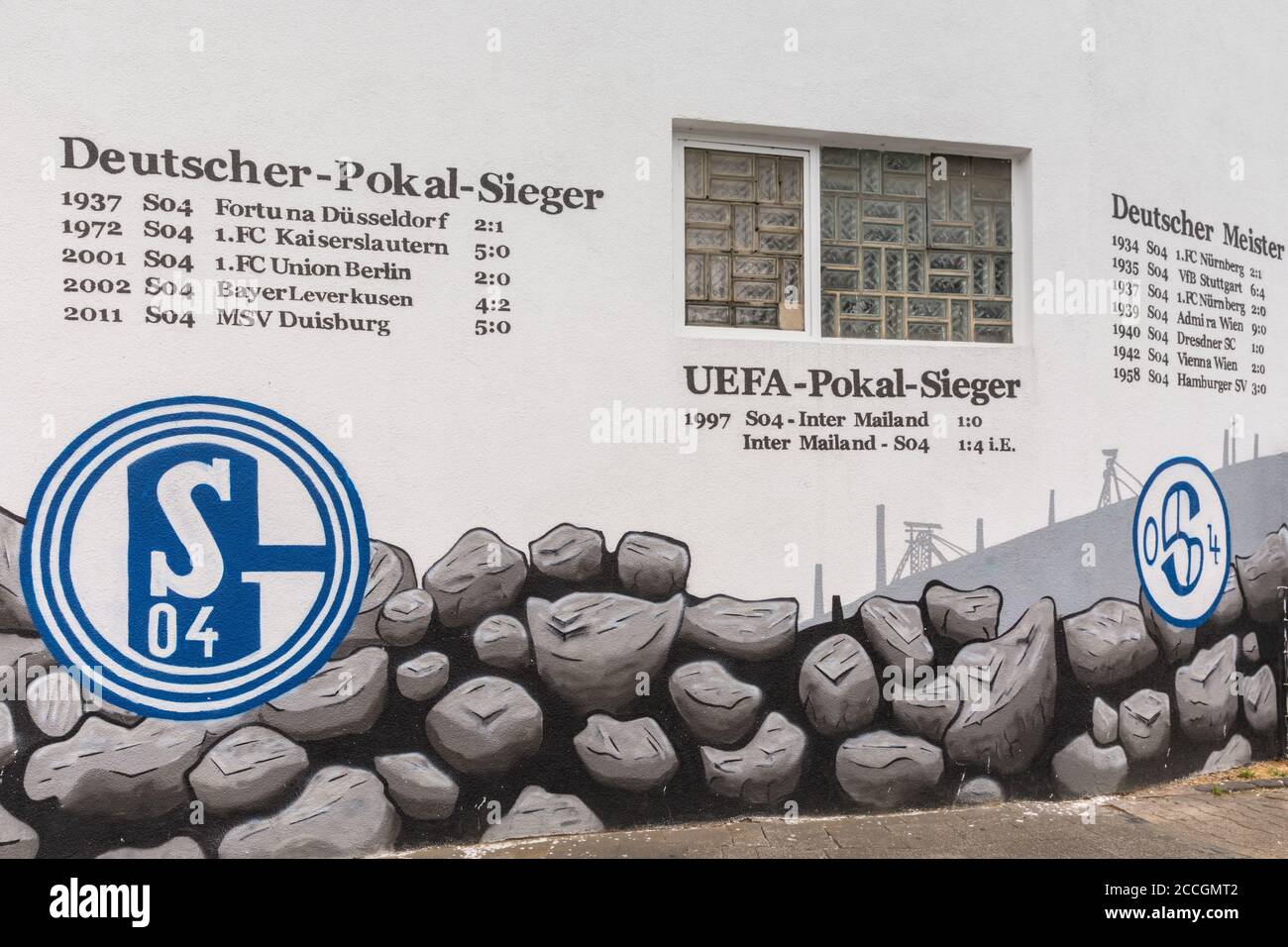 Wall inscriptions and grafitti of FC Schalke 04 football club championship titles at Schalker Meile fan area, North Rhine-Westphalia, Germany Stock Photo