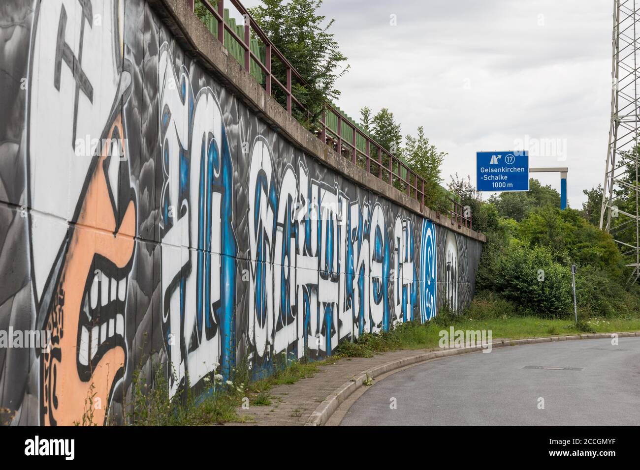 Schalke fan graffiti and motorway exit, Schalker Meile fan area of FC Schalke 04 Football club, in Gelsenkirchen, North Rhine-Westphalia, Germany Stock Photo