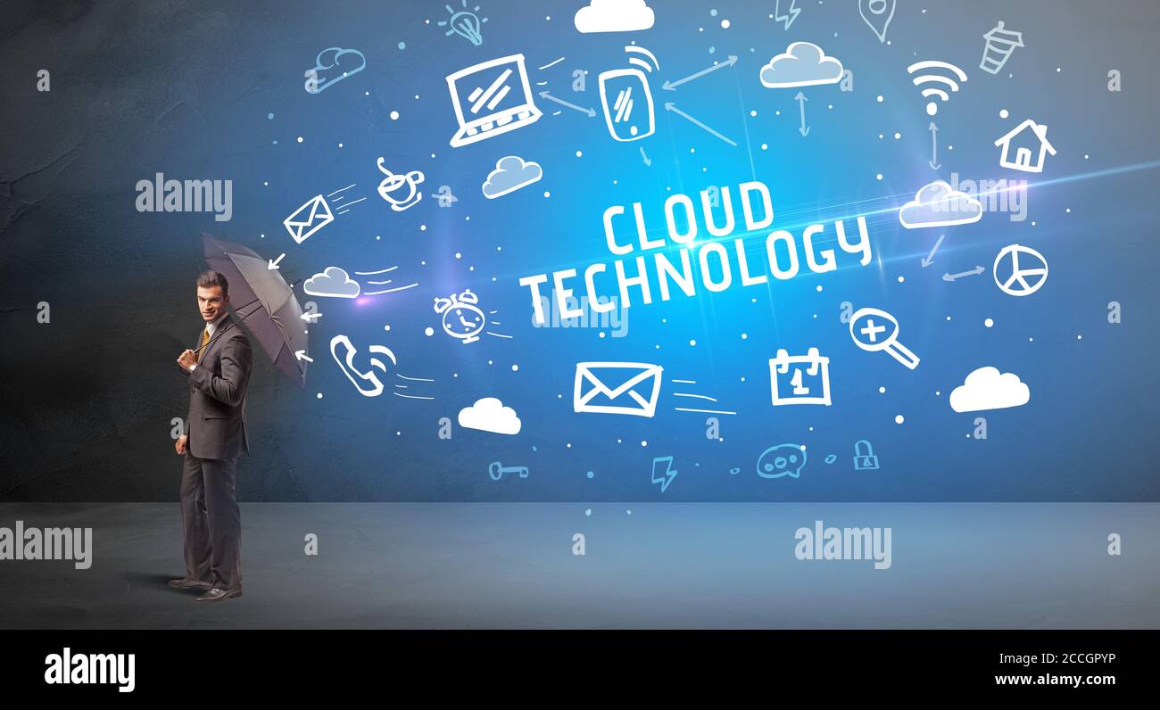 Businessman defending with umbrella from CLOUD TECHNOLOGY inscription, modern technology concept Stock Photo