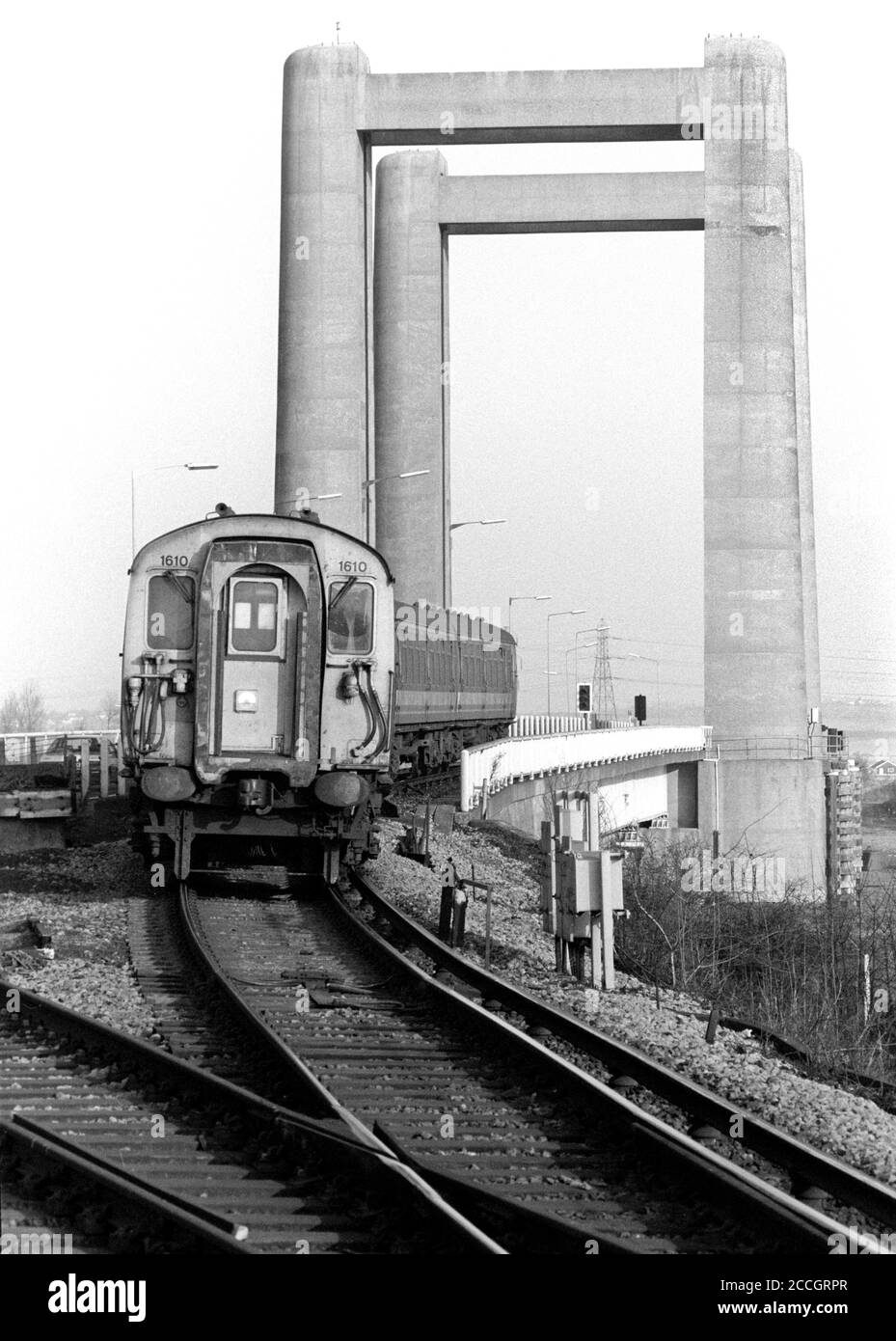 A Class 411 4-Cep electric multiple unit number 1610 rolls off the Kingsferry Bridge towards Swale with Network SouthEast service on the 28th December 1991. Stock Photo