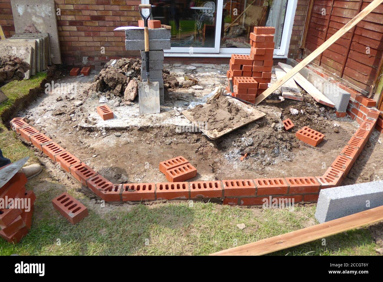 close up of concrete and brick foundation for conservatory base for