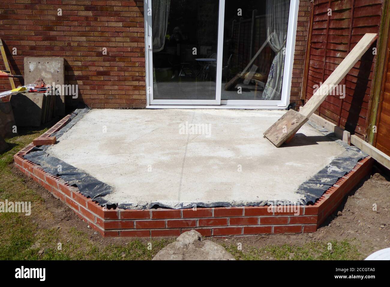 close up of concrete and brick foundation for conservatory base for
