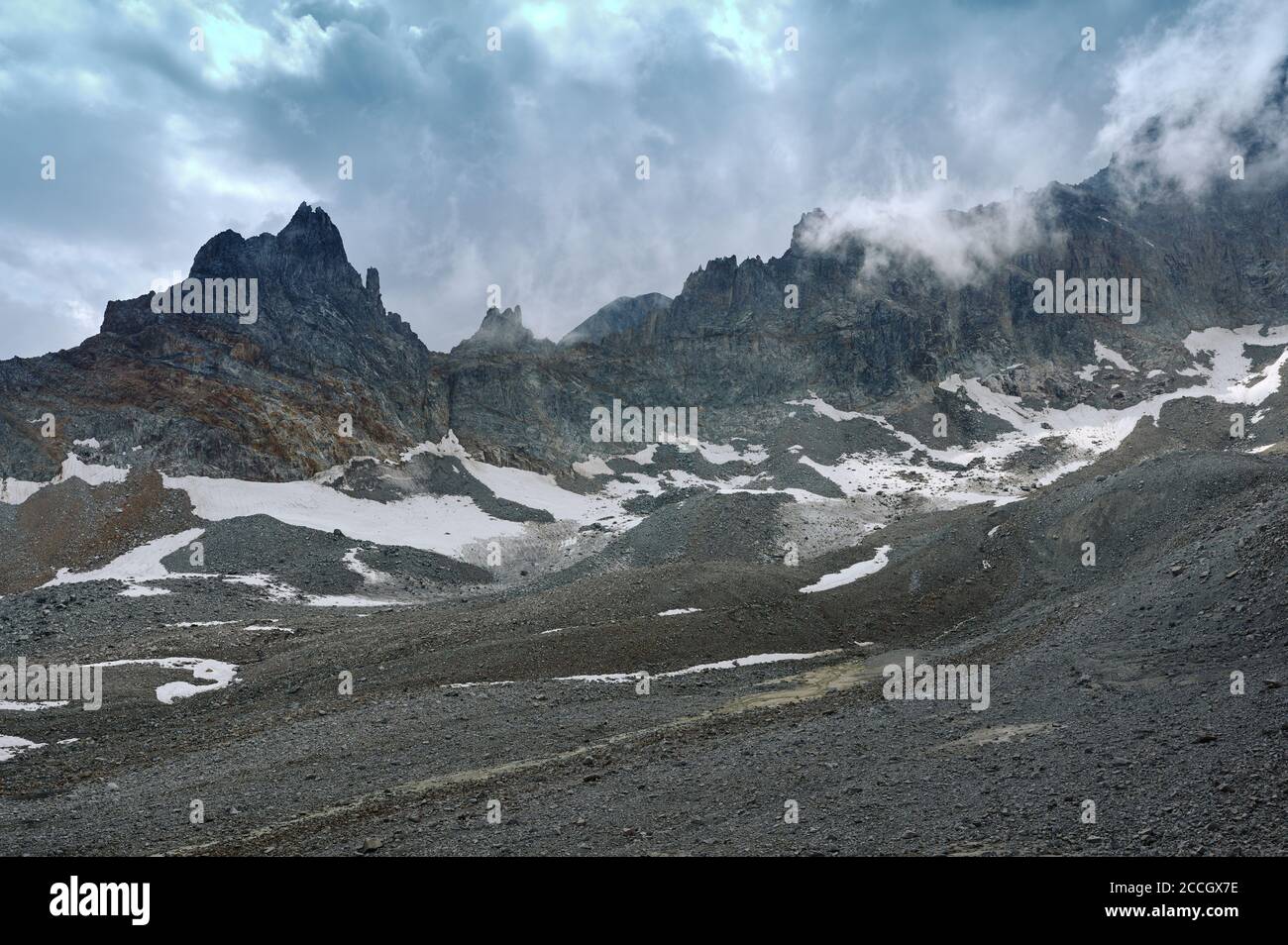 High mountain range landscape with rocky hills, white clouds and stone  valley. Lifeless wild nature. Wilderness ridge view Stock Photo - Alamy