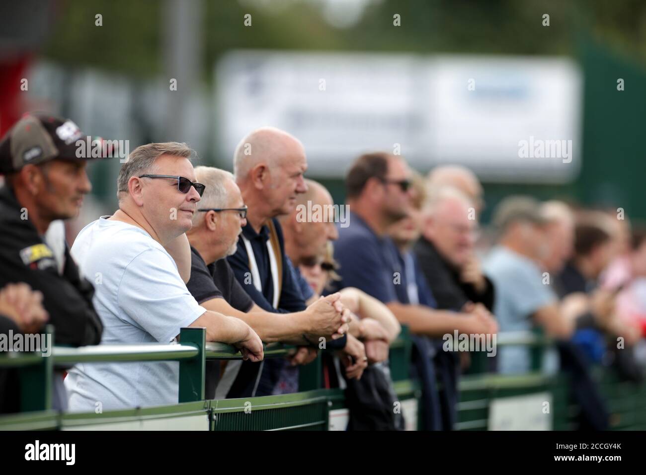 Fans watch the pre-season friendly match at the Trico Stadium, Redditch. Stock Photo