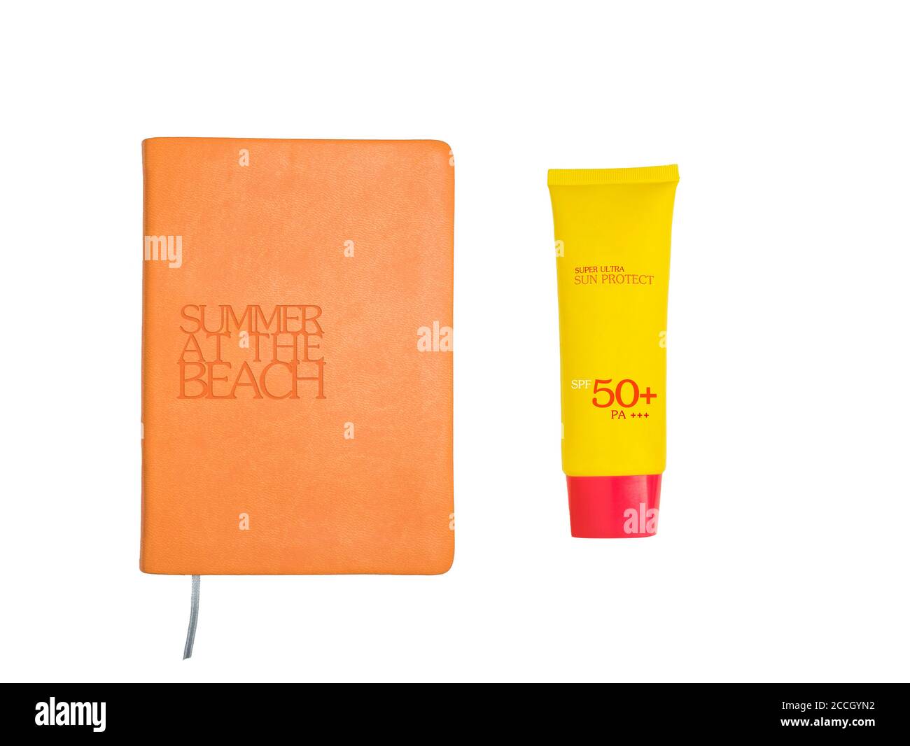Summer accessories concept: Top view of summer accessories: book and sun uv protect lotion in yellow and orange tone isolated on white background Stock Photo