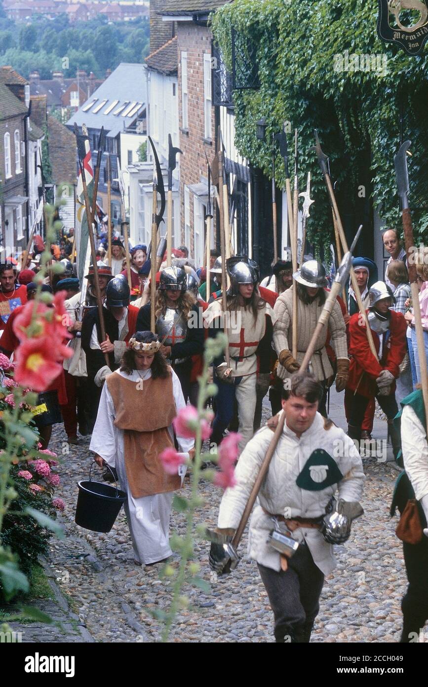 Medieval procession along Mermaid Street, Rye, East Sussex, England, UK Stock Photo