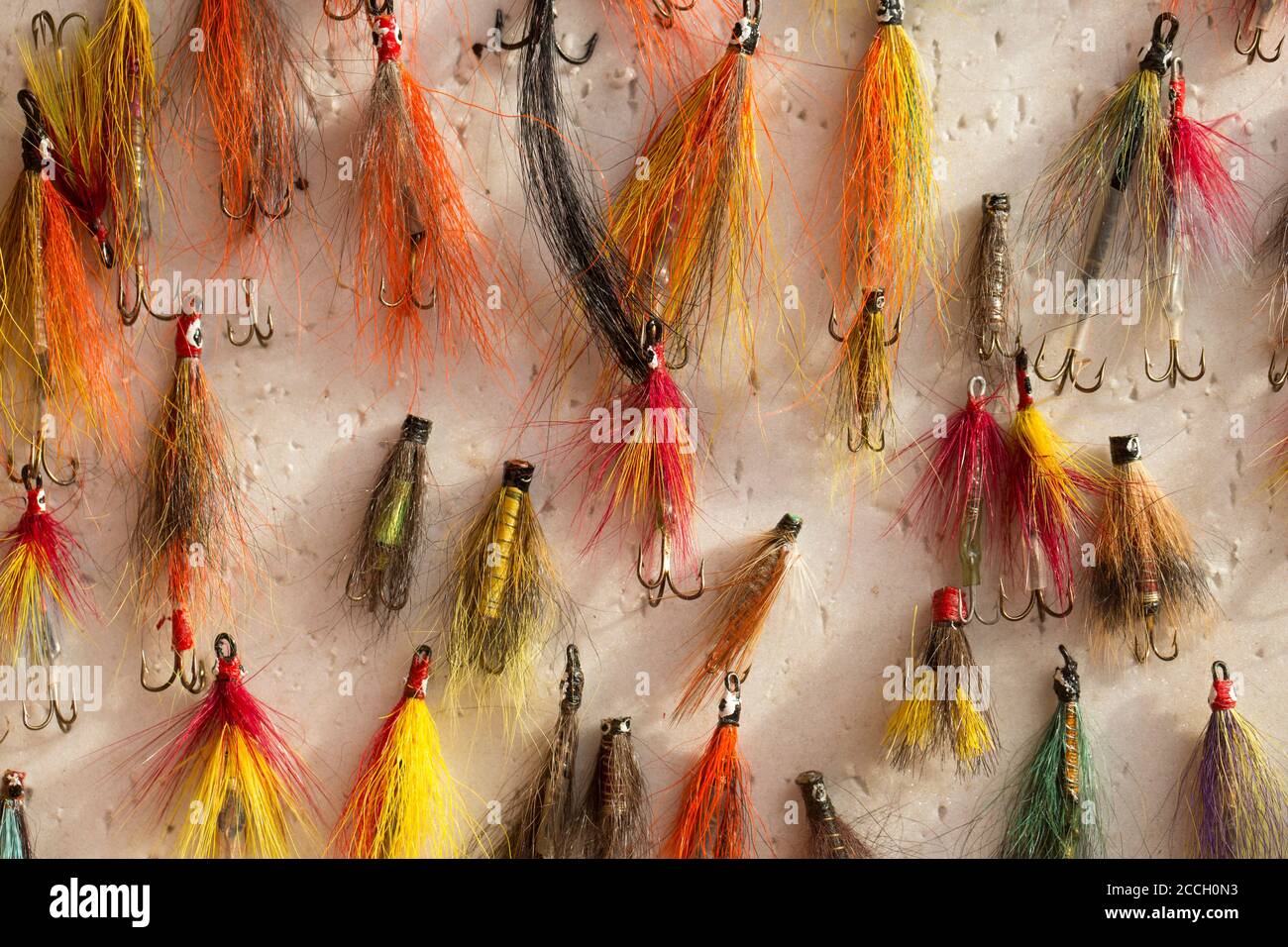 https://c8.alamy.com/comp/2CCH0N3/salmon-fishing-flies-in-a-fly-box-or-reservoir-many-of-which-appear-to-have-been-homemade-from-a-collection-of-fishing-tackle-dorset-england-uk-gb-2CCH0N3.jpg