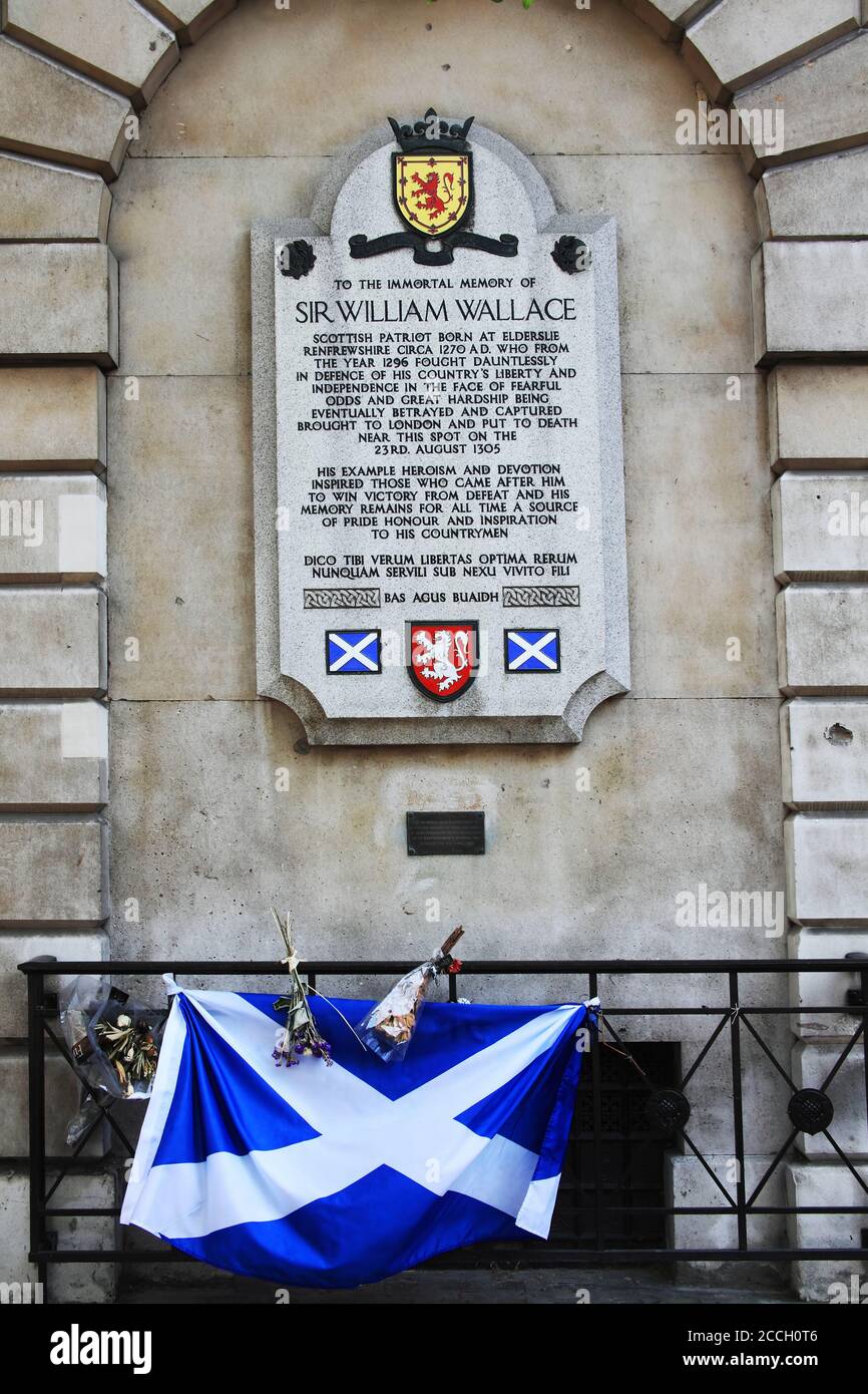London, UK, April 30, 2011 : Memorial plaque to Sir William Wallace (Braveheart) outside St Bartholomew's Hospital in Smithfields with the Scottish Sc Stock Photo