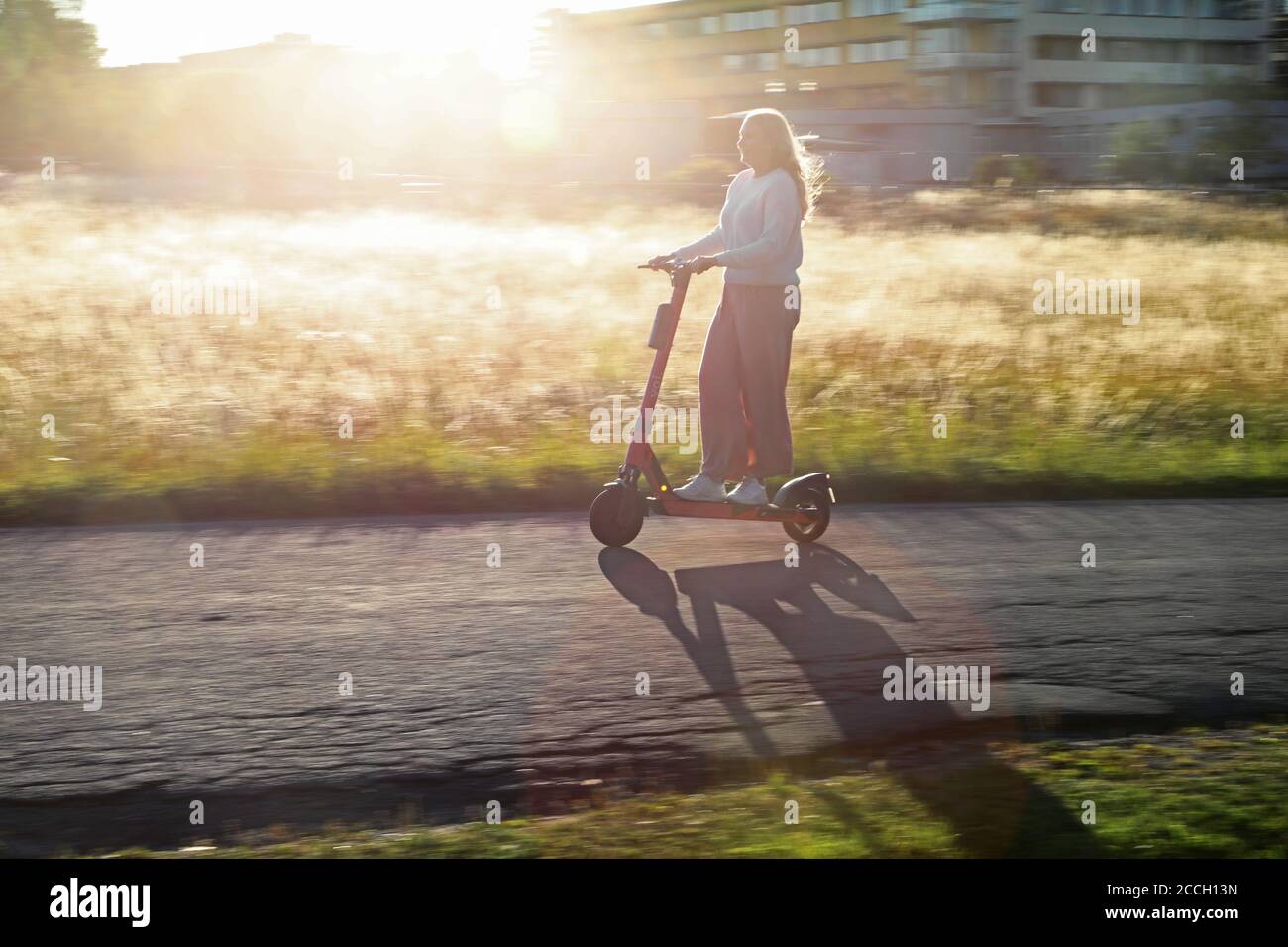 Uppsala, Sweden 20200811 A girl riding a VOI scooter on a street in