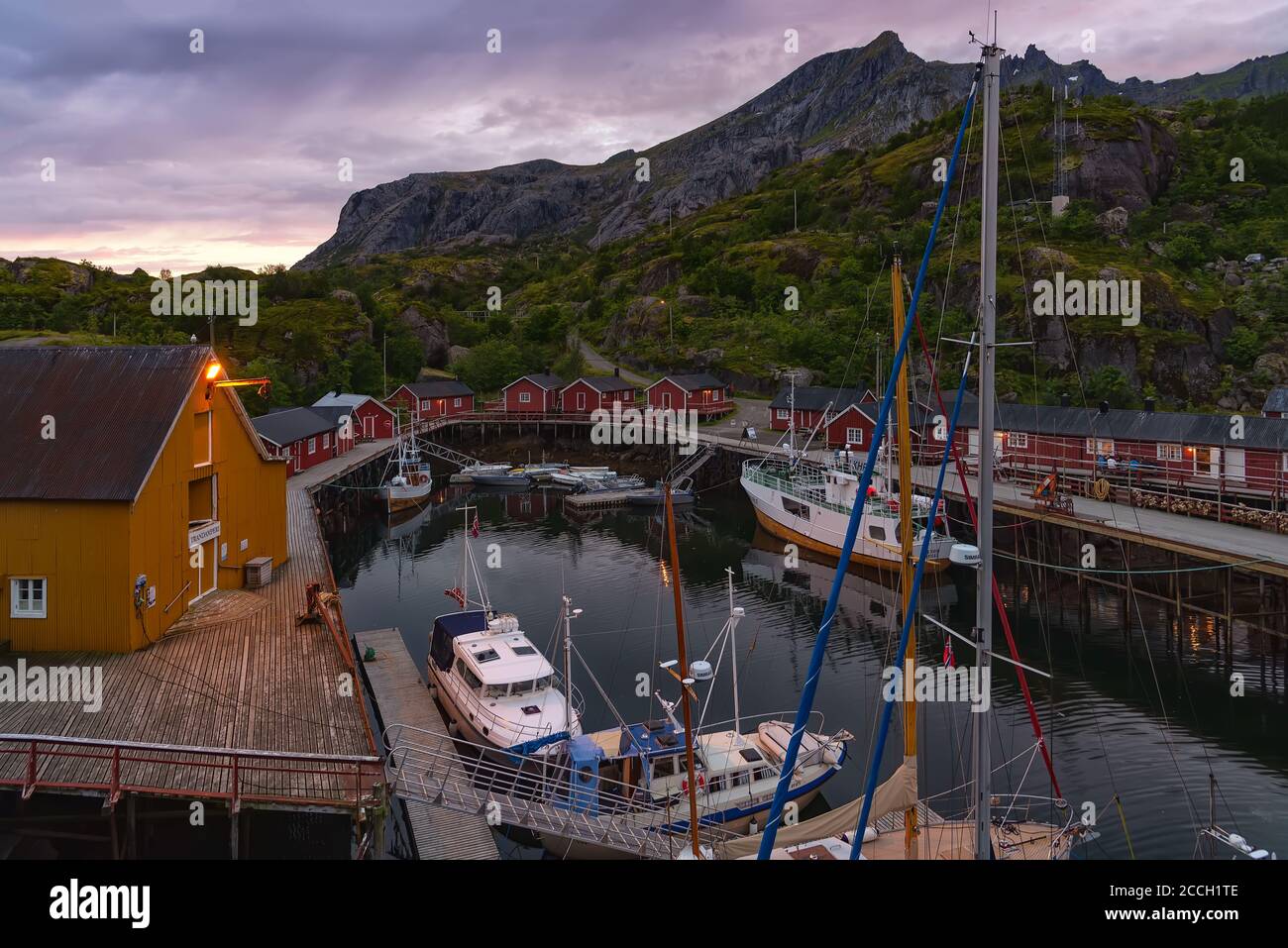 Nusfjord, Norway - August 20, 2016: View of the harbor at sunset. Nusfjord is one of the oldest and best preserved fishermen village of Norway Stock Photo