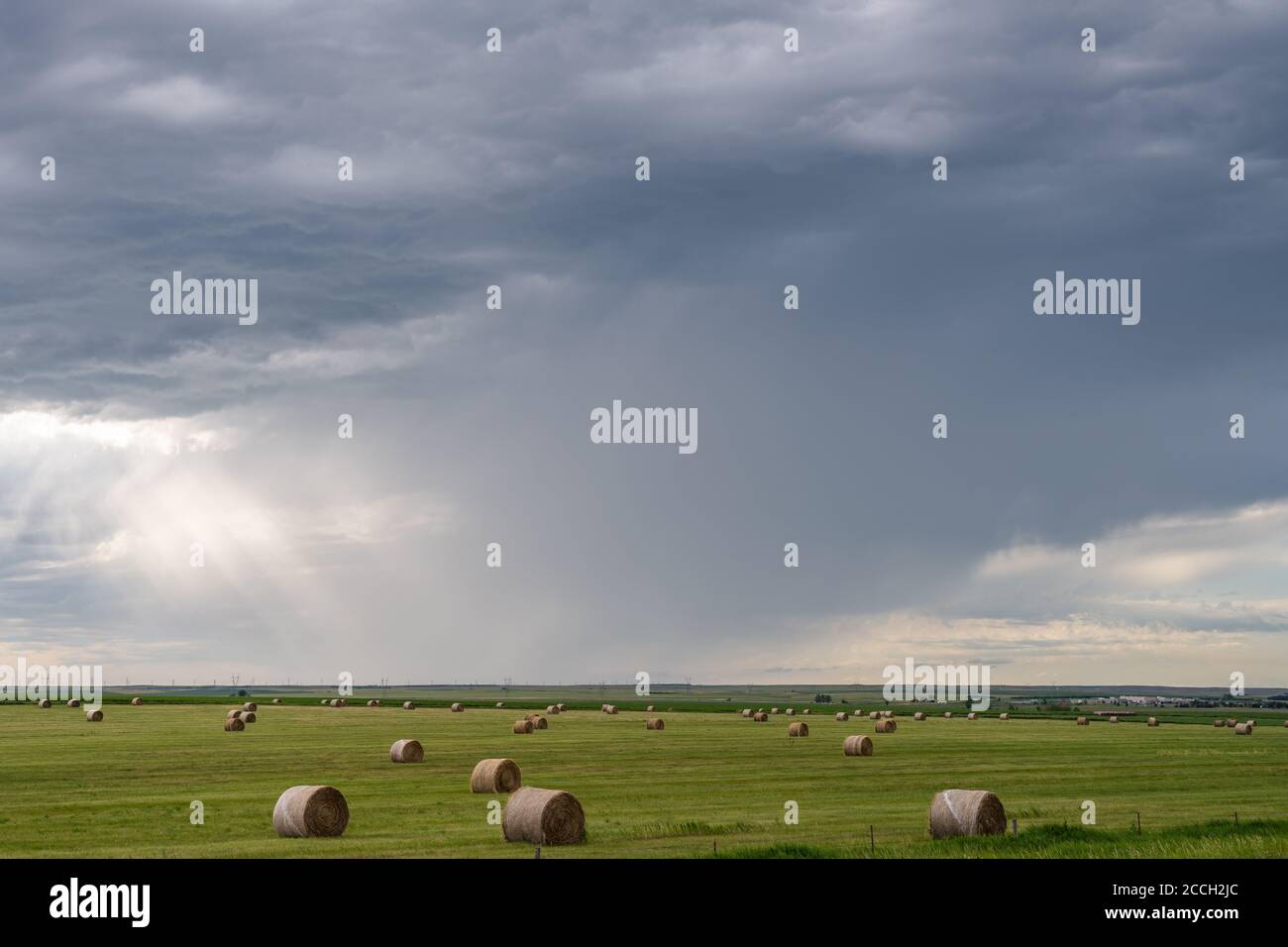 Hay bales with dramatic sky in rural South Dakota Stock Photo