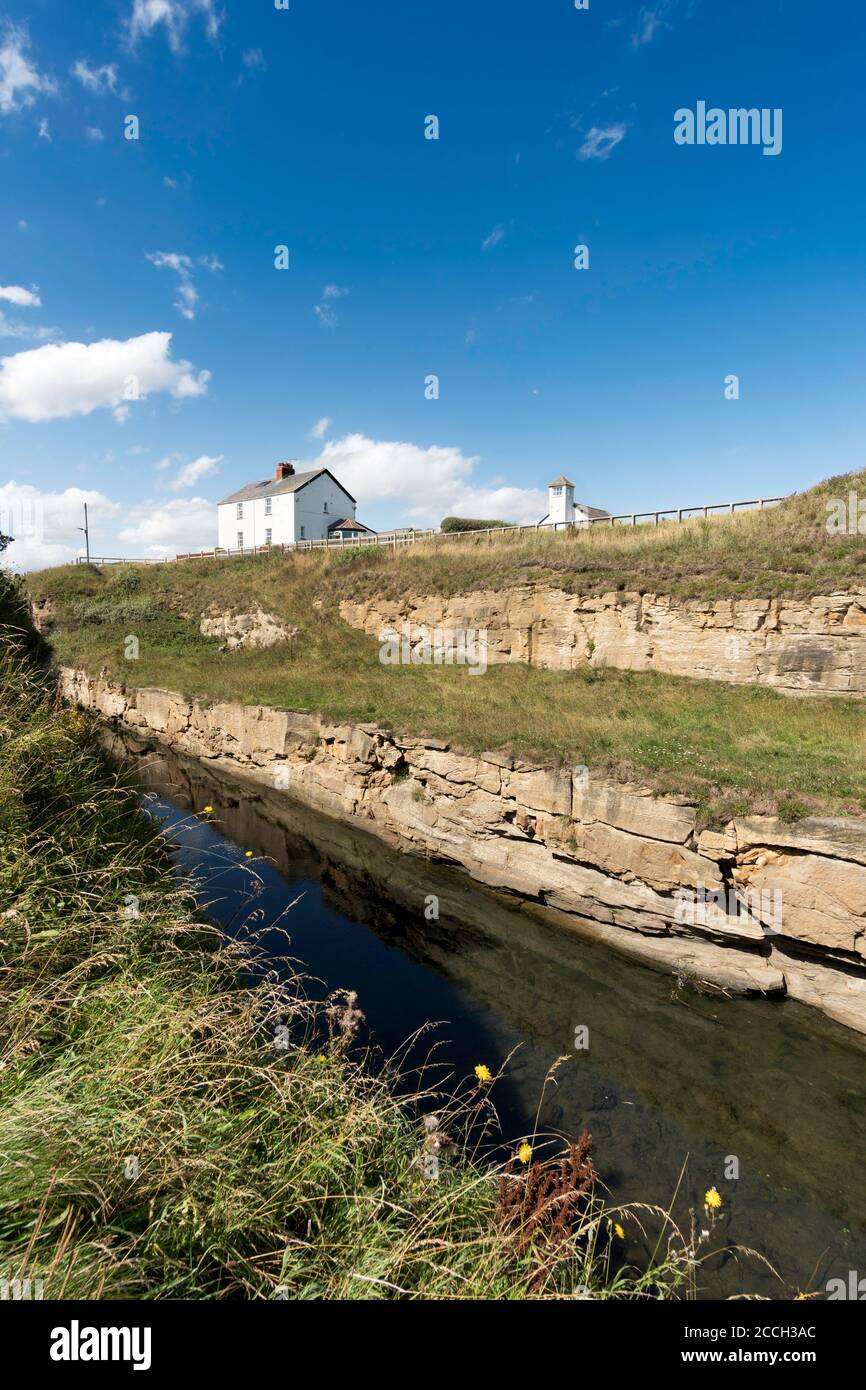 The Cut, or man made channel to the sea, at Seaton Sluice in Northumberland, England UK Stock Photo