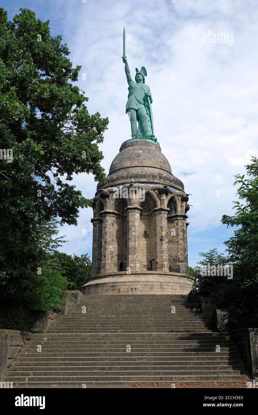 Detmold, Germany - 20 August 2020: The dramatic-looking 'Hermannsdenkmal' (German for 'Hermann Monument') near Detmold, Germany, against a blue sky. Stock Photo