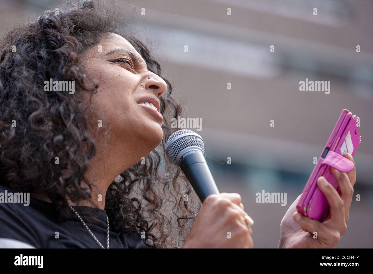 London, UK. 22nd August 2020. Author, Sheena Patel, gives a speech in front of Tate modern art gallery, in protest of the institution’s decision to cut 313 jobs from its commercial arm, Tate Enterprises. Credit: Neil Atkinson/Alamy Live News Stock Photo