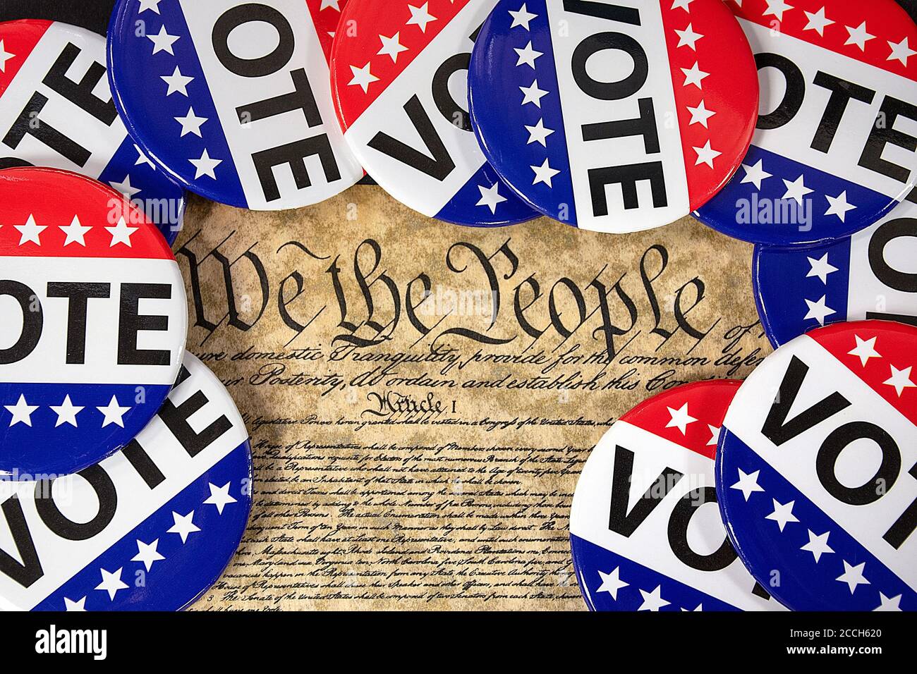 close up of election vote pins on United States Constitution document Stock Photo