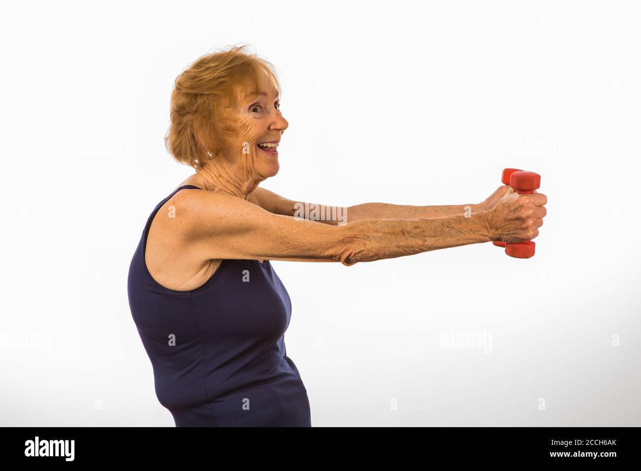 Senior Woman Lifting Two Pound Dumbbells Stock Photo