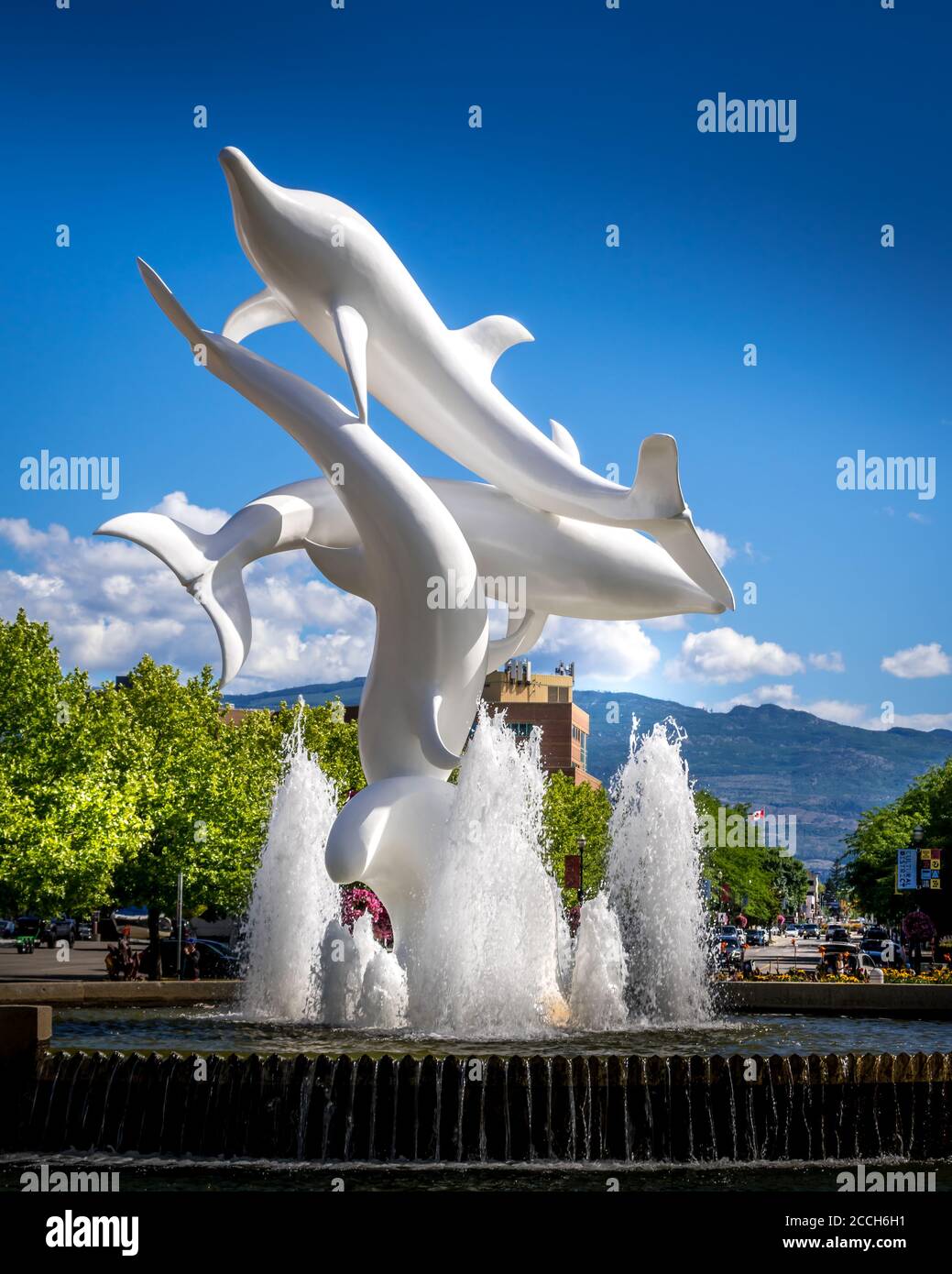 Rhapsody, a group of Fiberglass Dolphins, in a Fountain at Rhapsody Plaza in the city of Kelowna Stock Photo