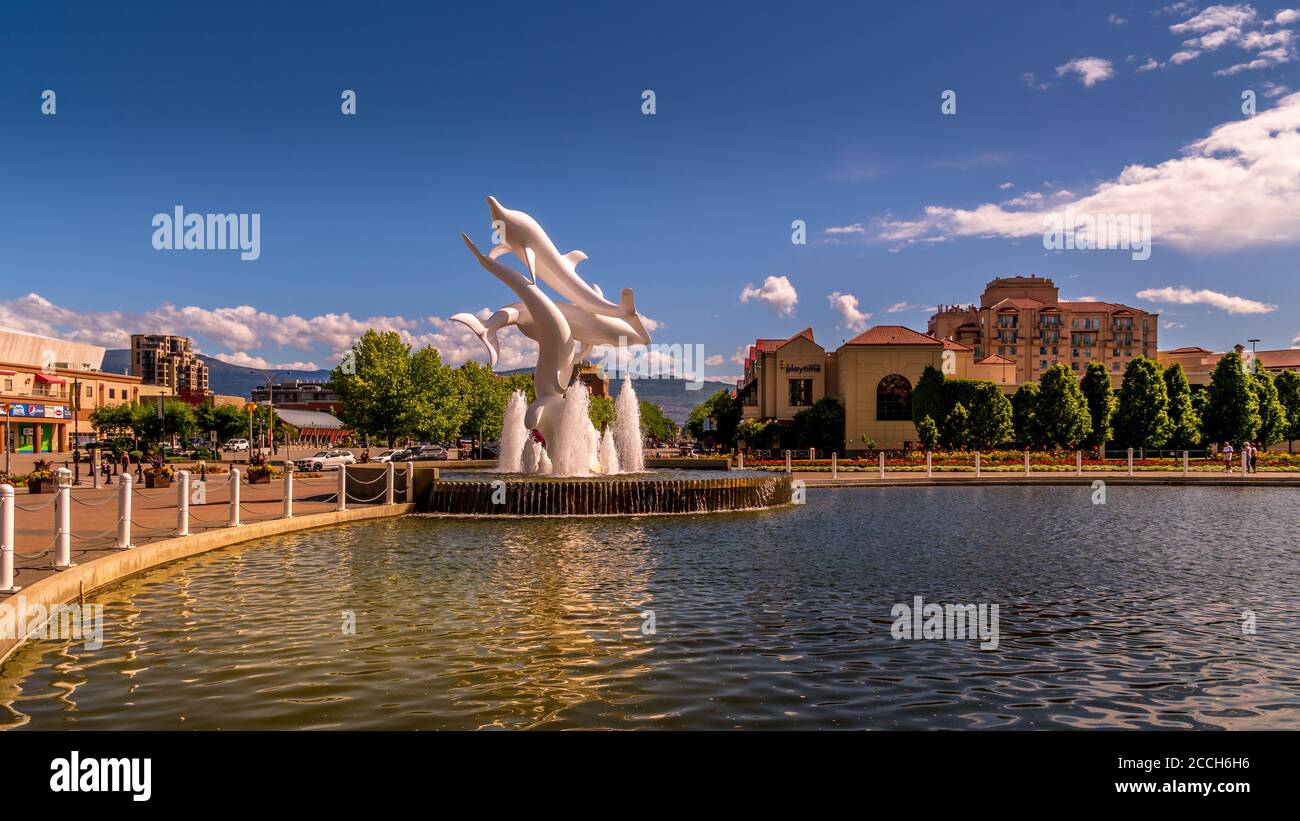 Rhapsody, a group of Fiberglass Dolphins, in a Fountain at Rhapsody Plaza in the city of Kelowna Stock Photo