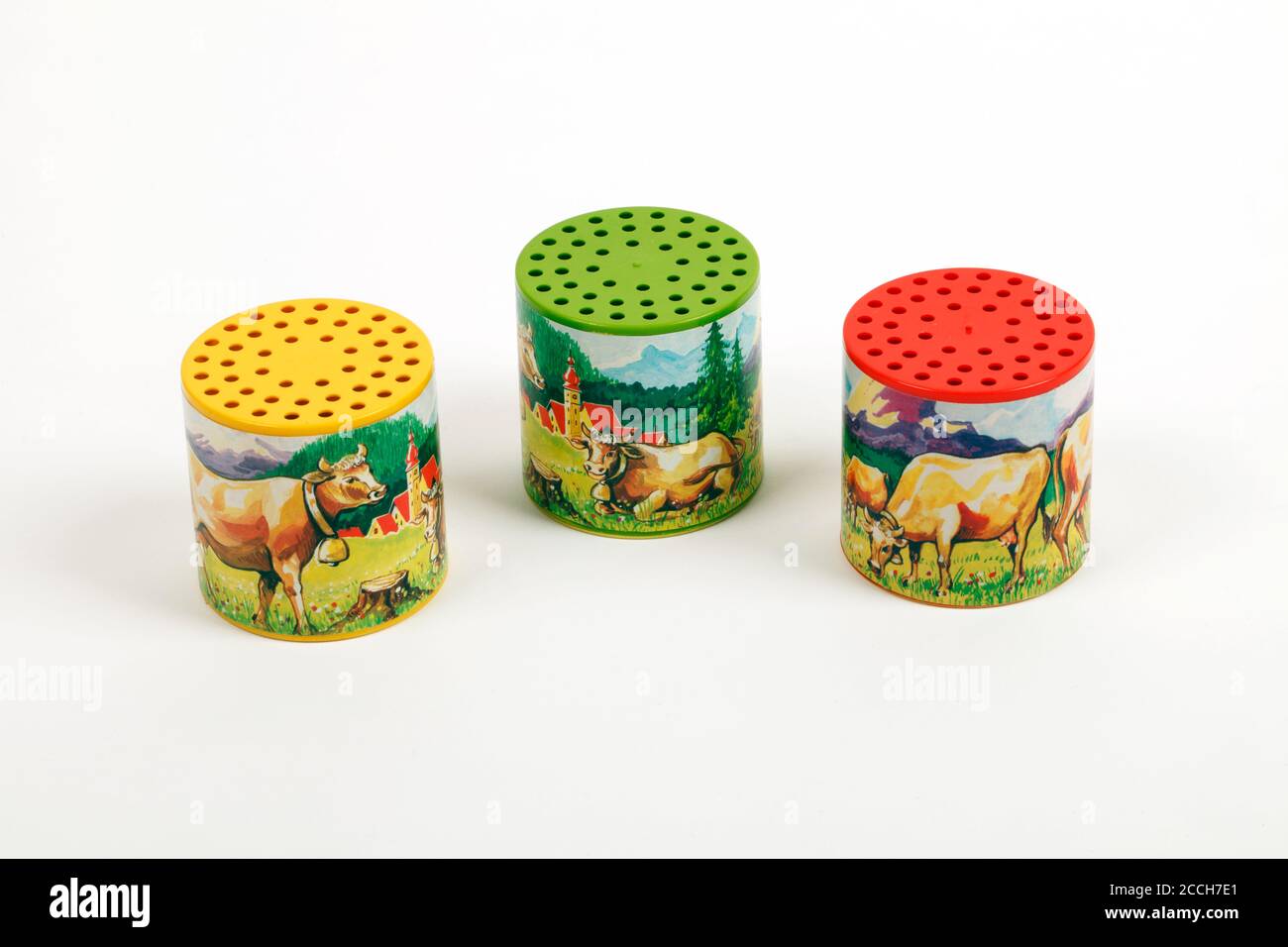 Cow sound of mooing simulation childs toy. Three colours. Sound holes on top. Also known as the Moo box. Stock Photo