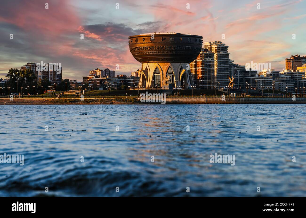 Center of family near the Kazanka river in Kazan. Sunset cityscape. Kazan Palace of marriage registration is made in the form of a cauldron Cup Stock Photo