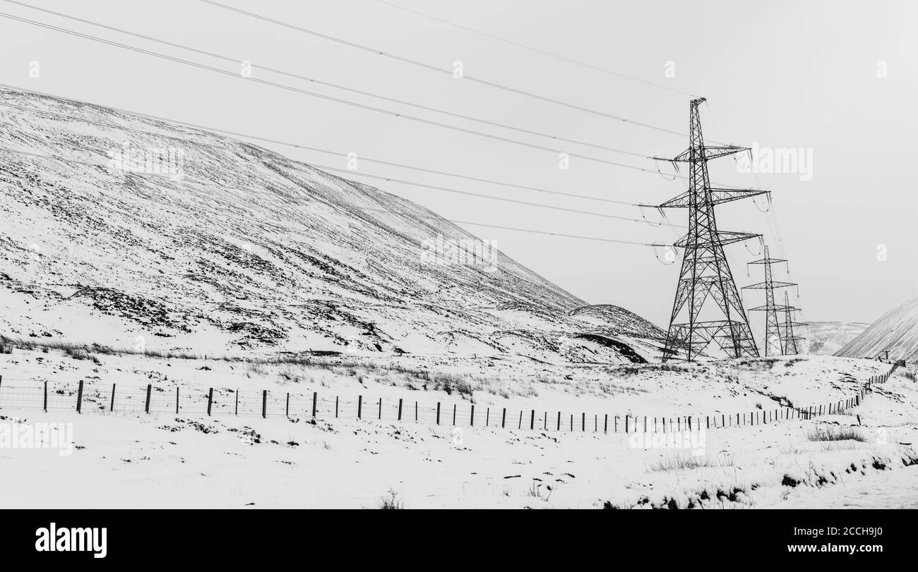 Electricity Pylons on Snow Covered Scottish Hillside Stock Photo - Alamy
