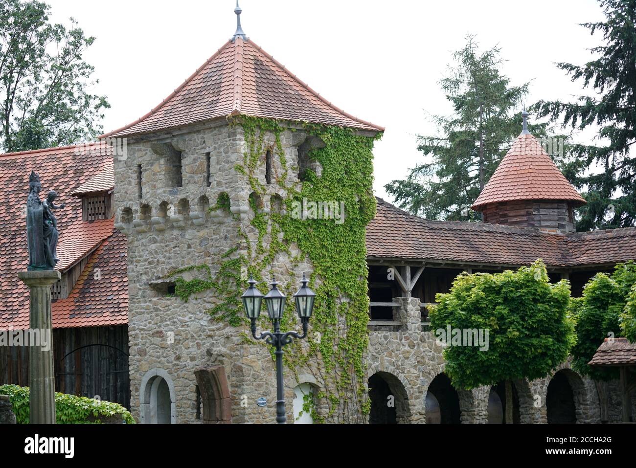 House facade overgrown with wild wine photographed in autumn in a park Stock Photo